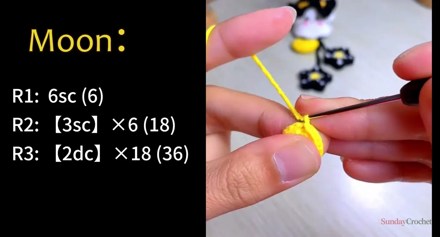 Hands crochet the yellow moon charm with its three rounds of increasing stitch counts