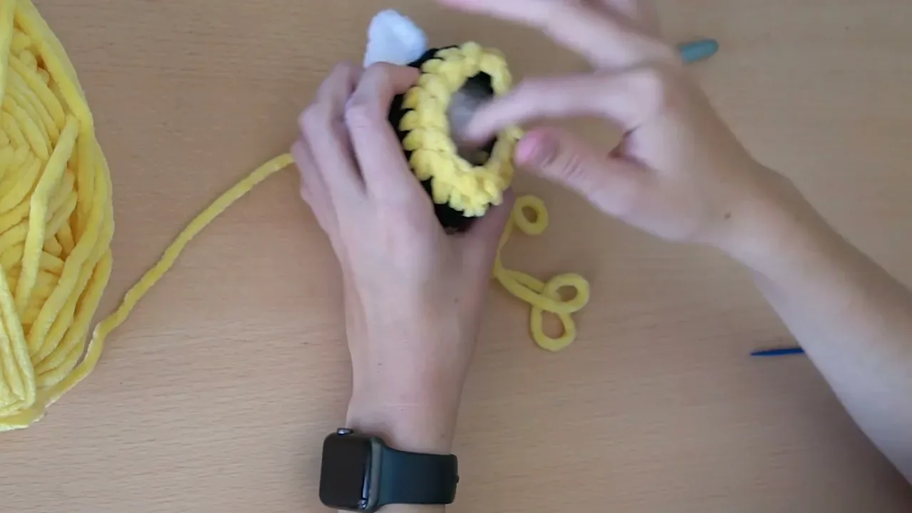 Fiber stuffing is added to the bee before the final decrease round closes the opening