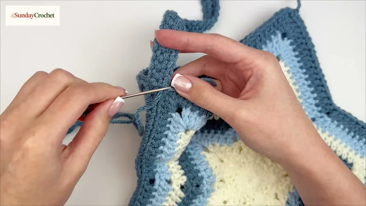 The crochet strap is sewn securely to one corner of the star tote opening
