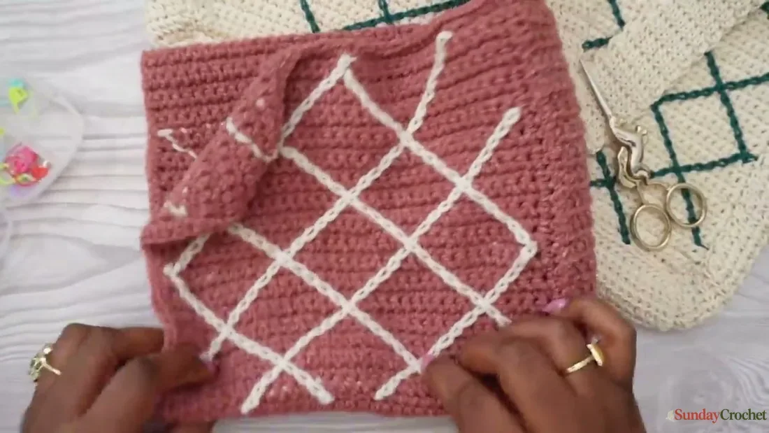 A completed crochet panel shows the contrasting diagonal stitches crossing into diamonds