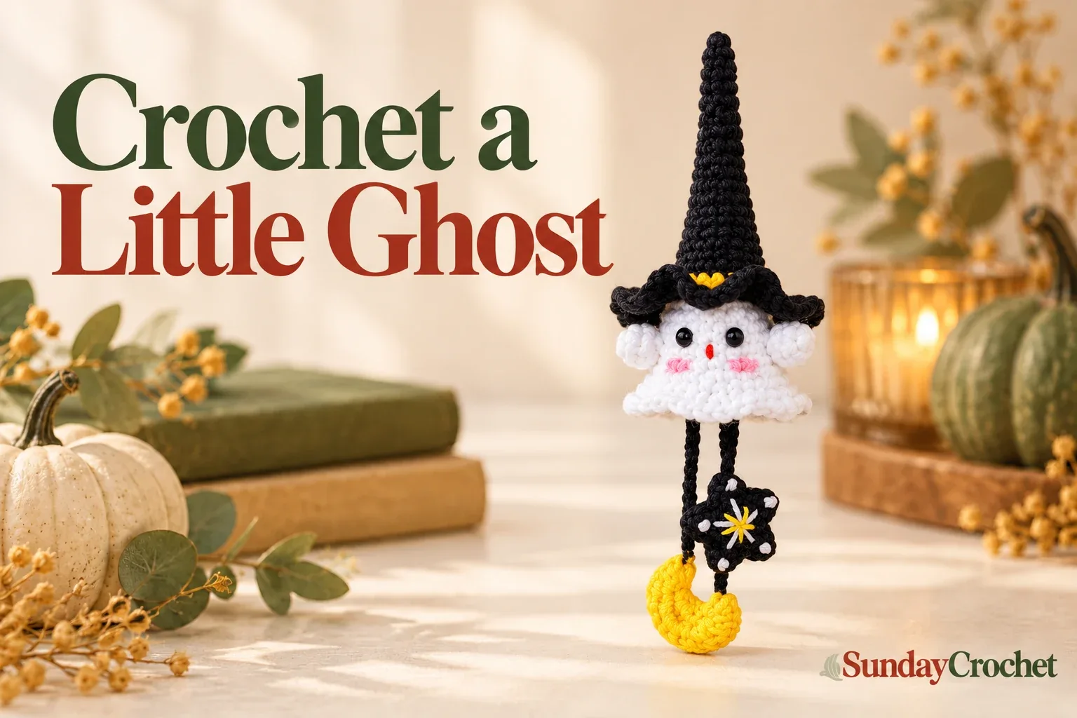 White crochet witch ghost wearing a pointed black hat and holding a yellow moon and star charm