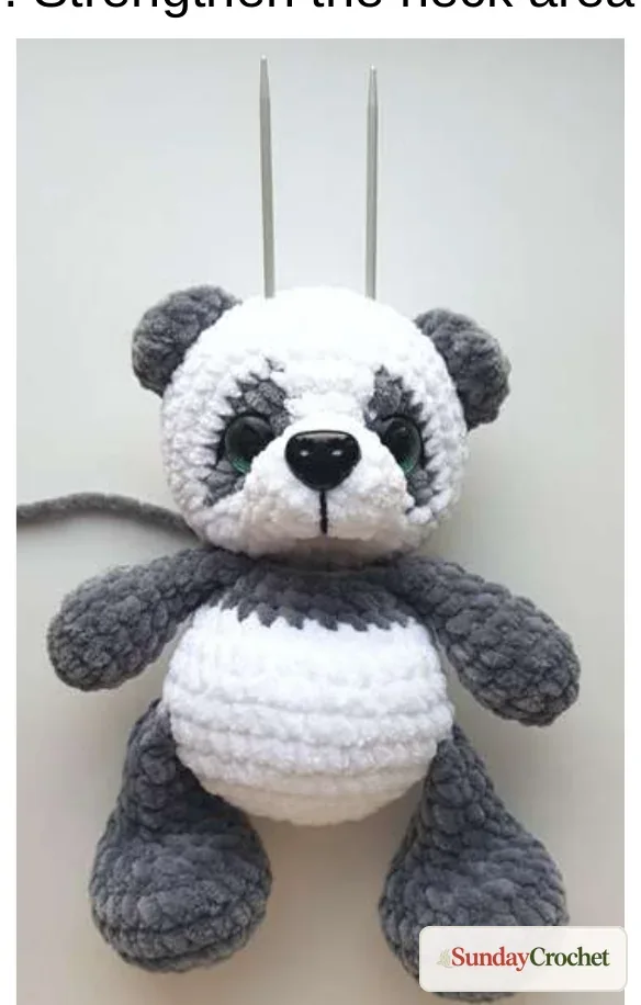 Panda head held in alignment with the body before the neck seam is sewn